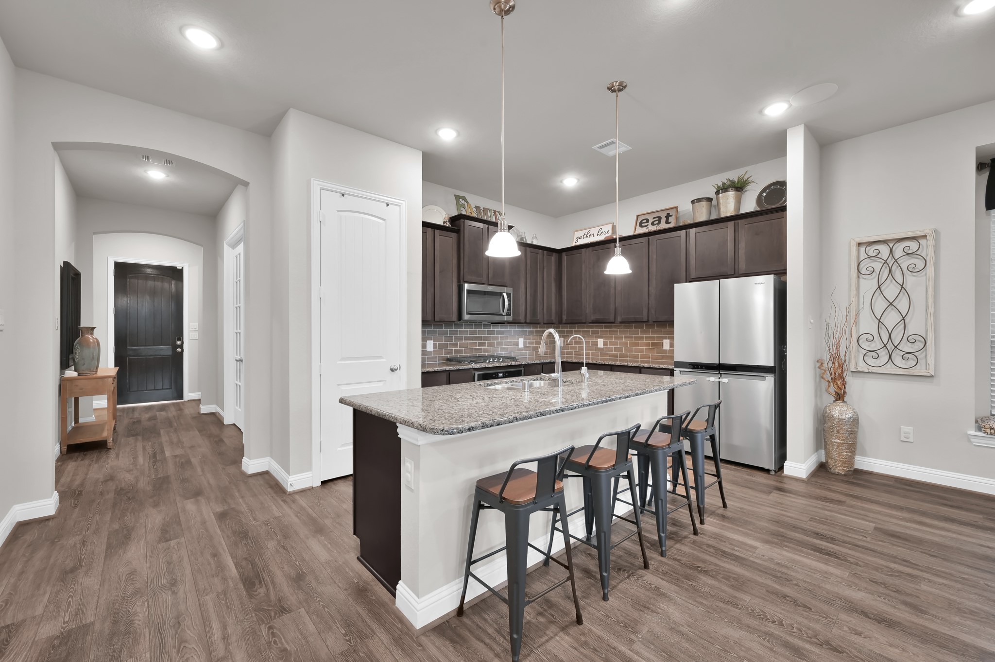 17413 Turtleweed Lane Conroe, TX 77385 - Photo 6 of 27 a large kitchen with a table and chairs