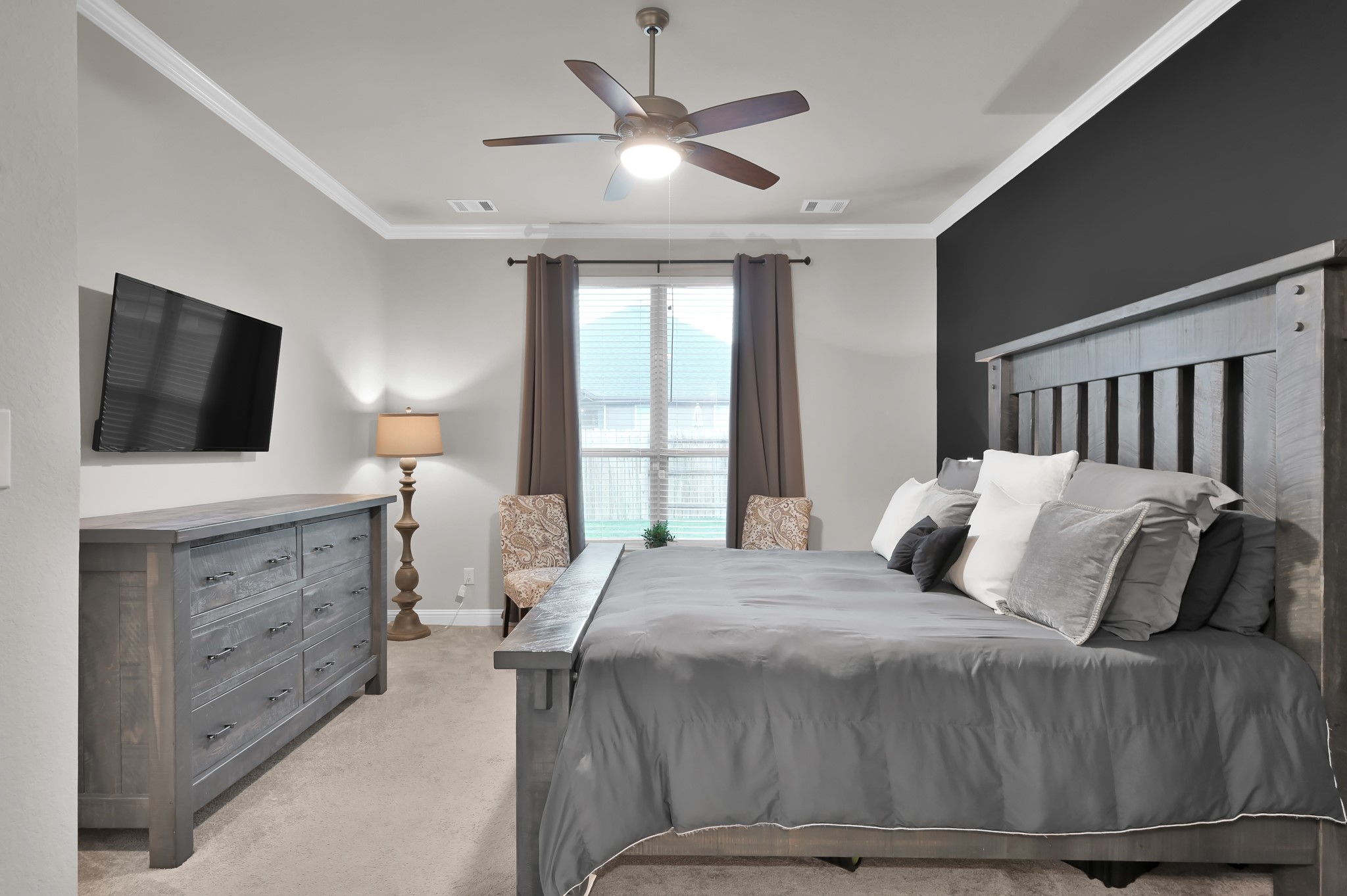 17413 Turtleweed Lane Conroe, TX 77385 - Photo 9 of 27 a bedroom with a bed and a flat screen tv