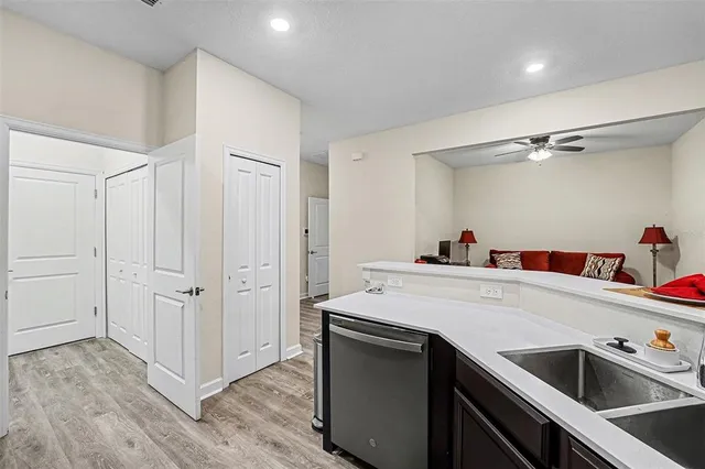 a kitchen with a sink and cabinets
