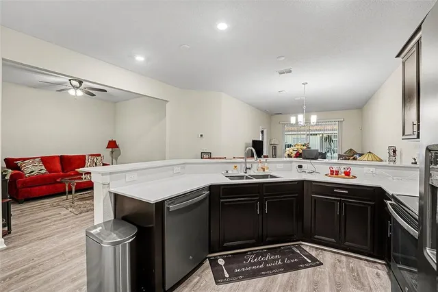 a kitchen with a sink and cabinets