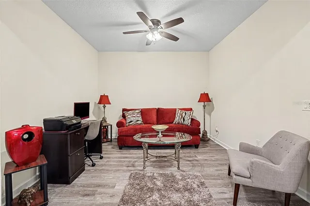 a living room with furniture and a chair
