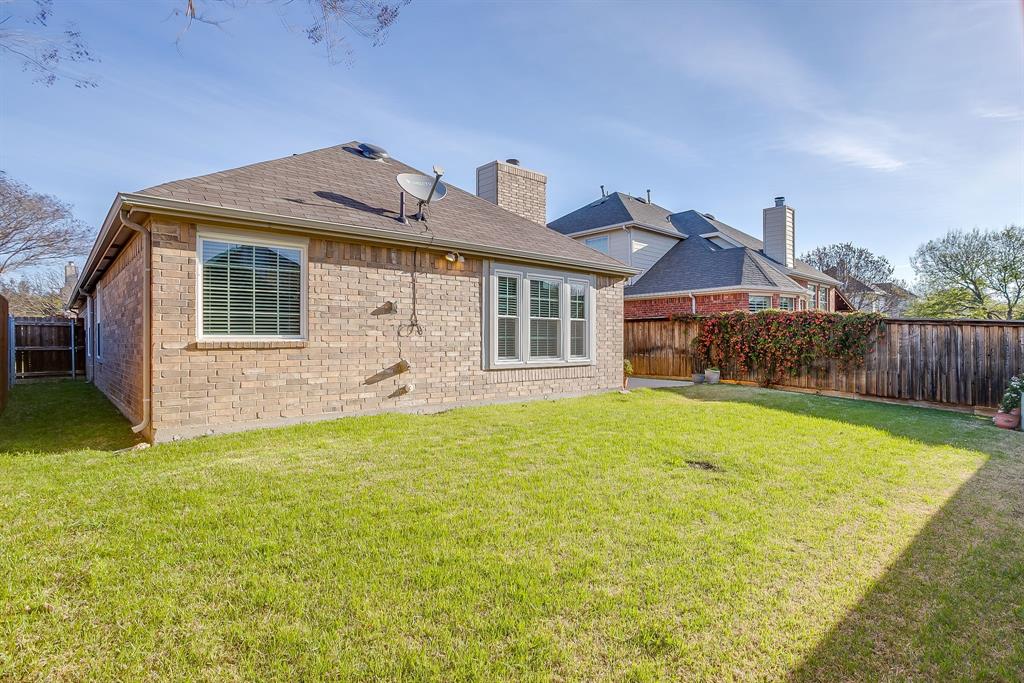 8105 Hosta Way Fort Worth, TX 76123 - Photo 32 of 33 a front view of a house with garden