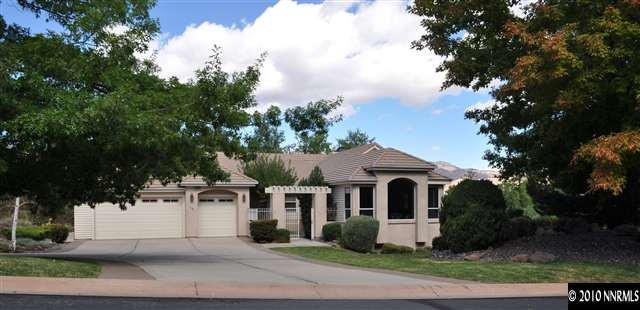 10 Promontory Pointe Reno, NV 89519 - Photo 1 of 13 a front view of a house with a garden