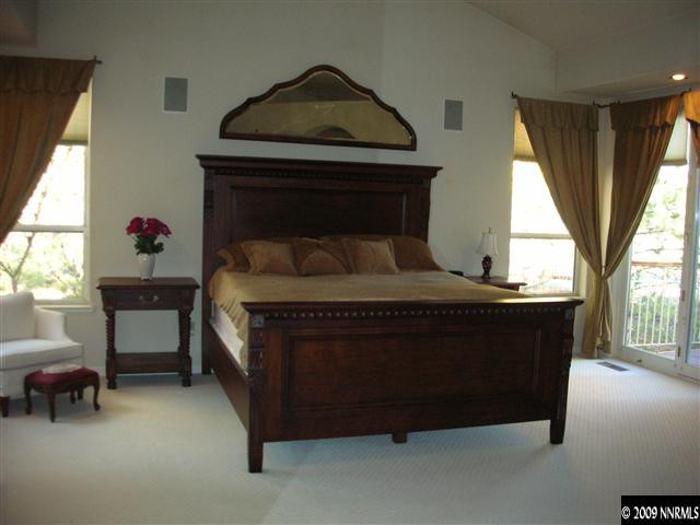 10 Promontory Pointe Reno, NV 89519 - Photo 9 of 13 a bed sitting in a bedroom next to a window