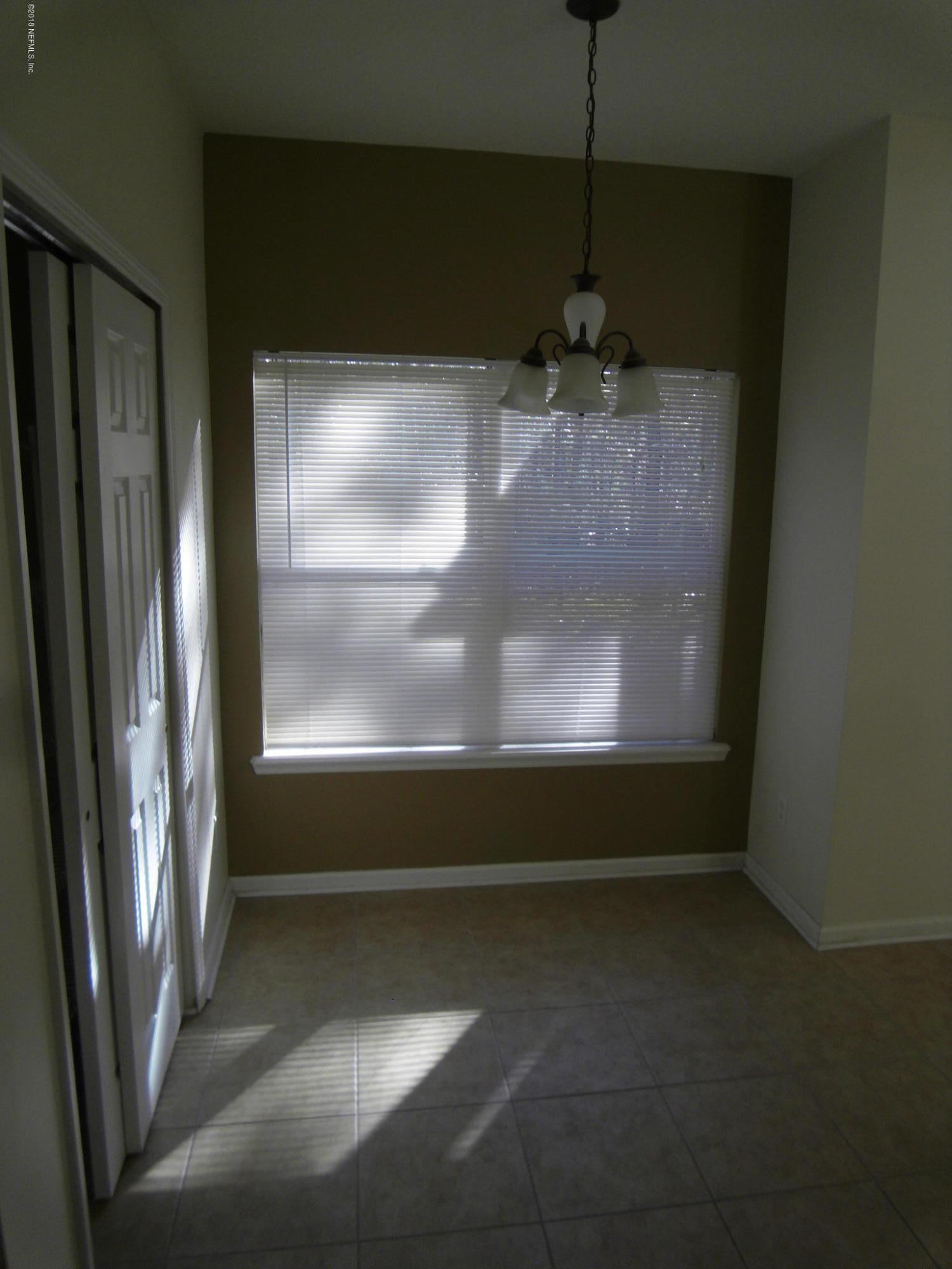 10142 Sandler Road Jacksonville, FL 32222 - Photo 11 of 33 a view of empty room with wooden floor and fan
