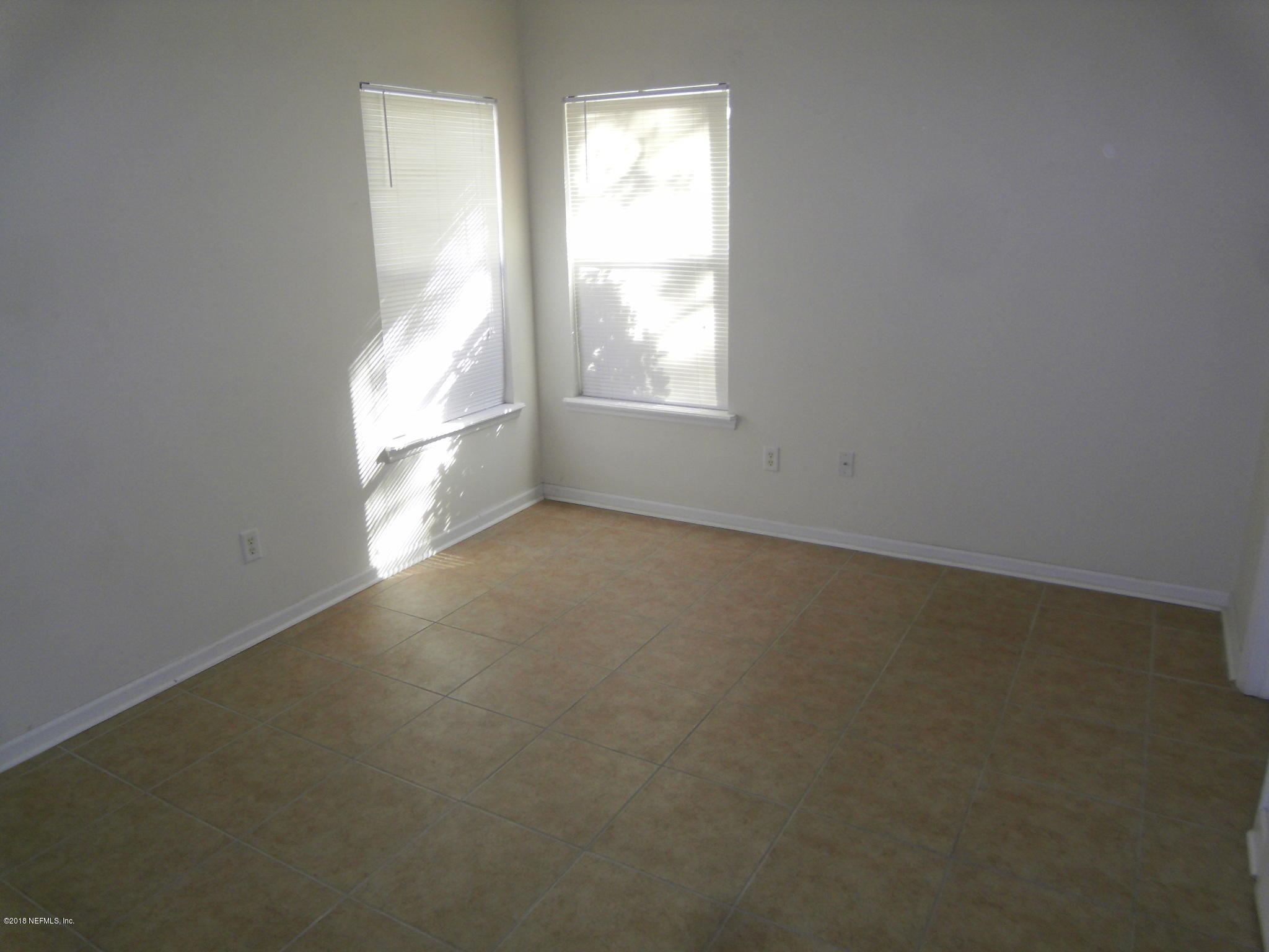 10142 Sandler Road Jacksonville, FL 32222 - Photo 13 of 33 an empty room with a window