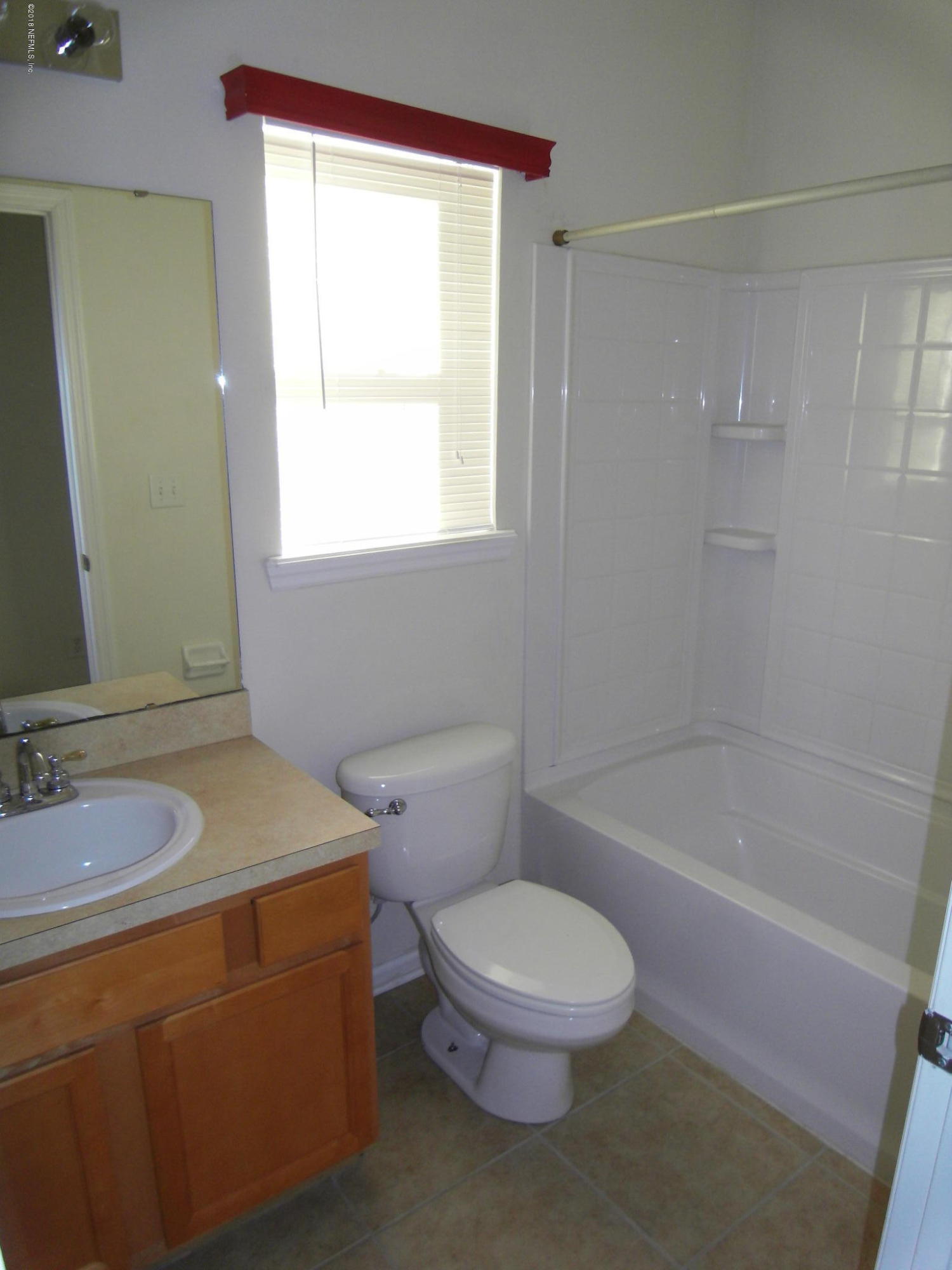 10142 Sandler Road Jacksonville, FL 32222 - Photo 14 of 33 a bathroom with a granite countertop sink a toilet and shower