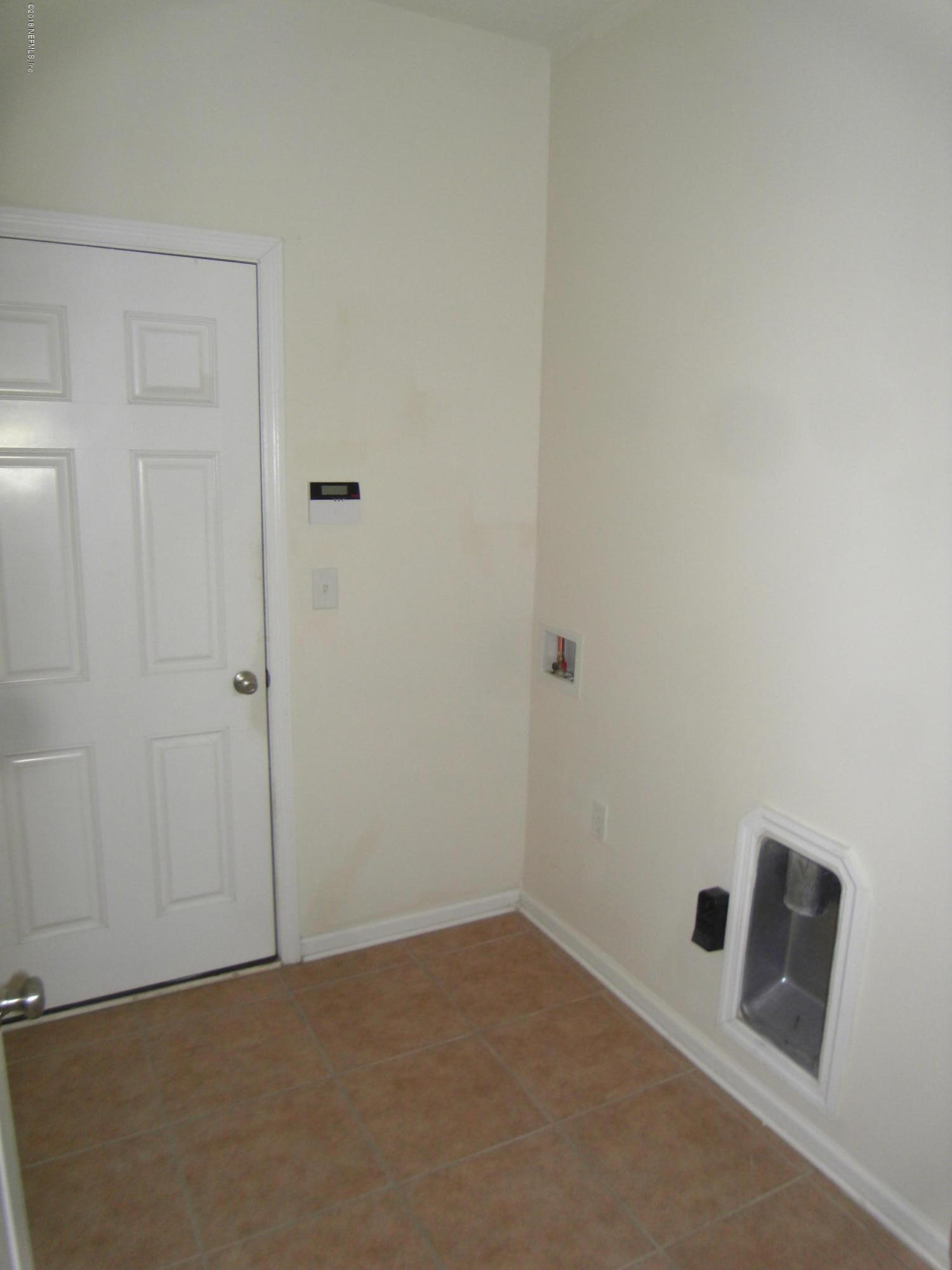 10142 Sandler Road Jacksonville, FL 32222 - Photo 16 of 33 a view of a room with a projector