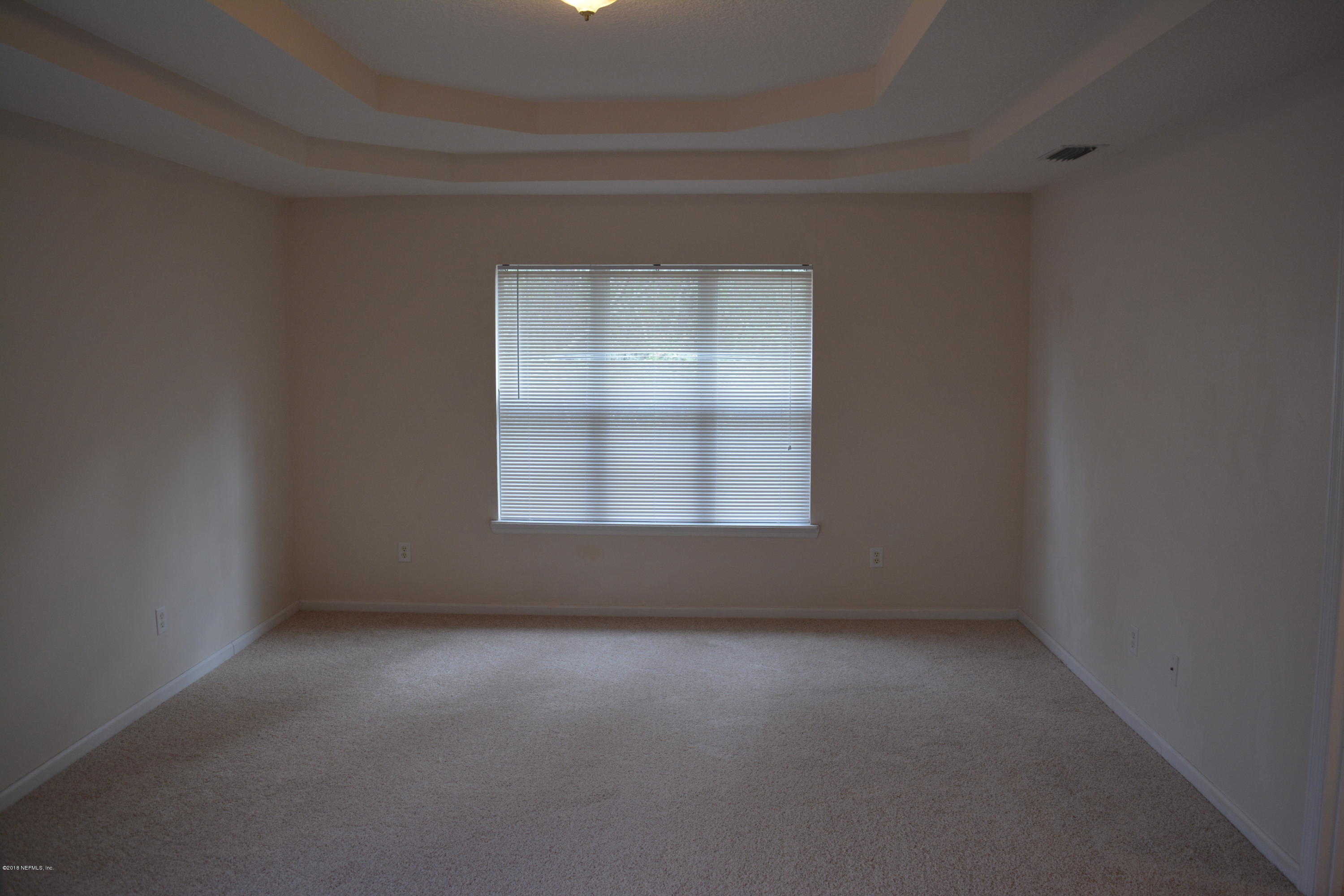10142 Sandler Road Jacksonville, FL 32222 - Photo 20 of 33 an empty room with a empty space and window