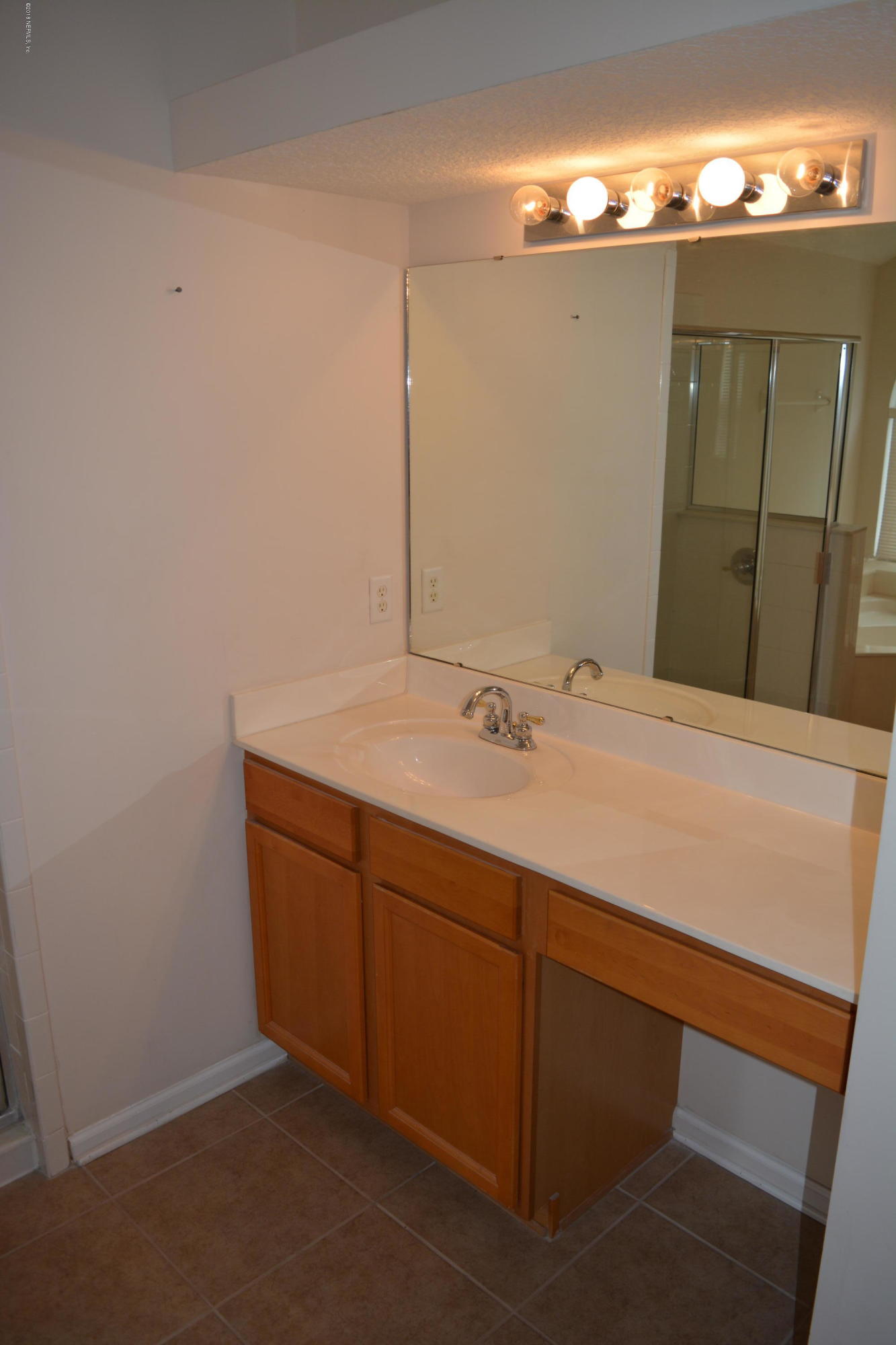 10142 Sandler Road Jacksonville, FL 32222 - Photo 23 of 33 a bathroom with a sink and a mirror