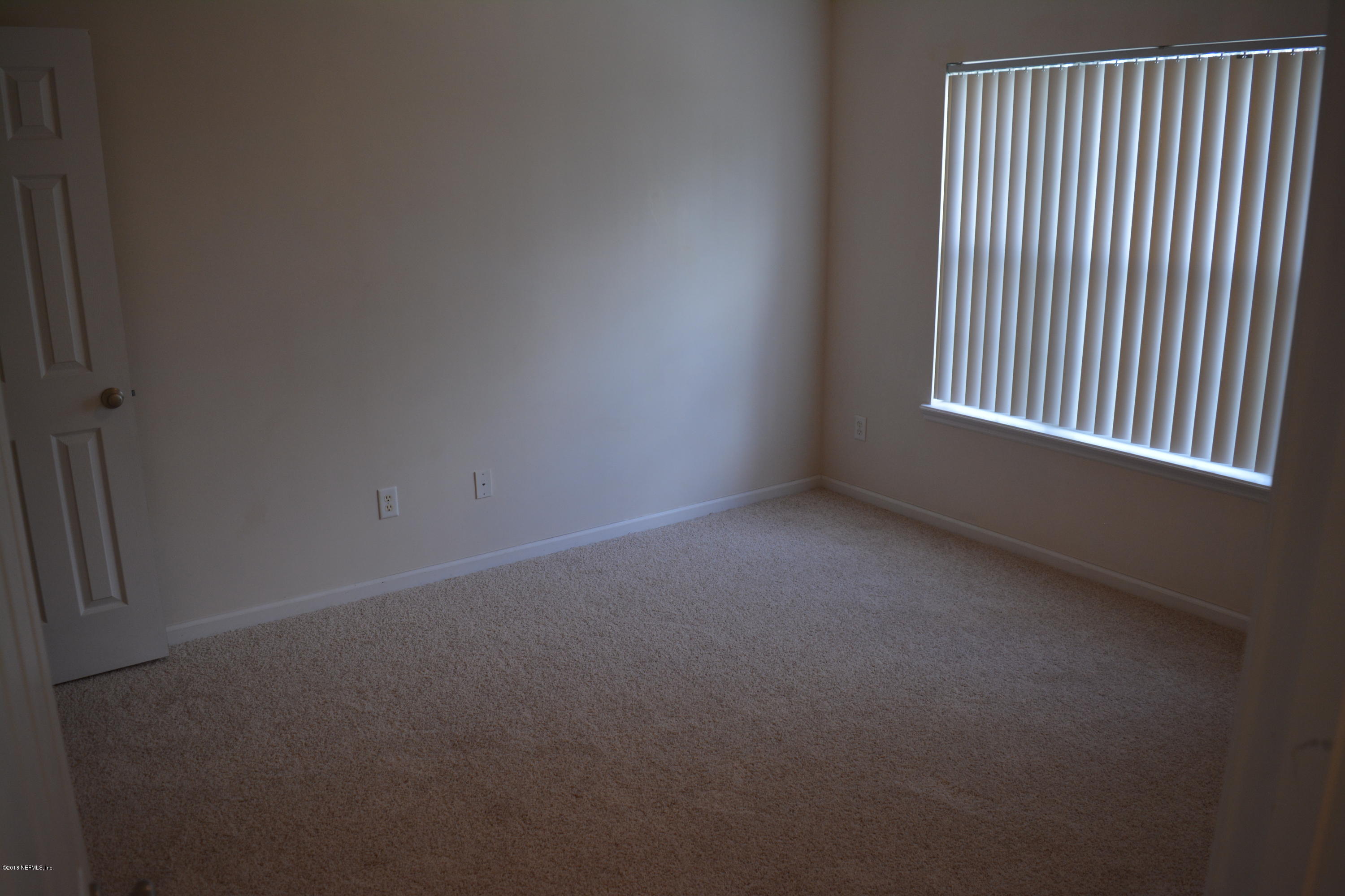 10142 Sandler Road Jacksonville, FL 32222 - Photo 27 of 33 a view of an empty room with a window