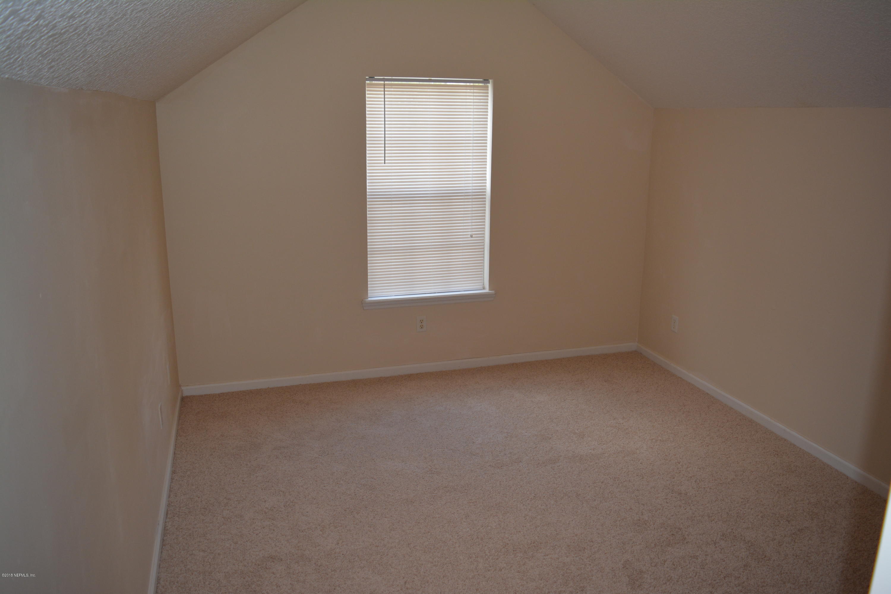 10142 Sandler Road Jacksonville, FL 32222 - Photo 29 of 33 an empty room with a window