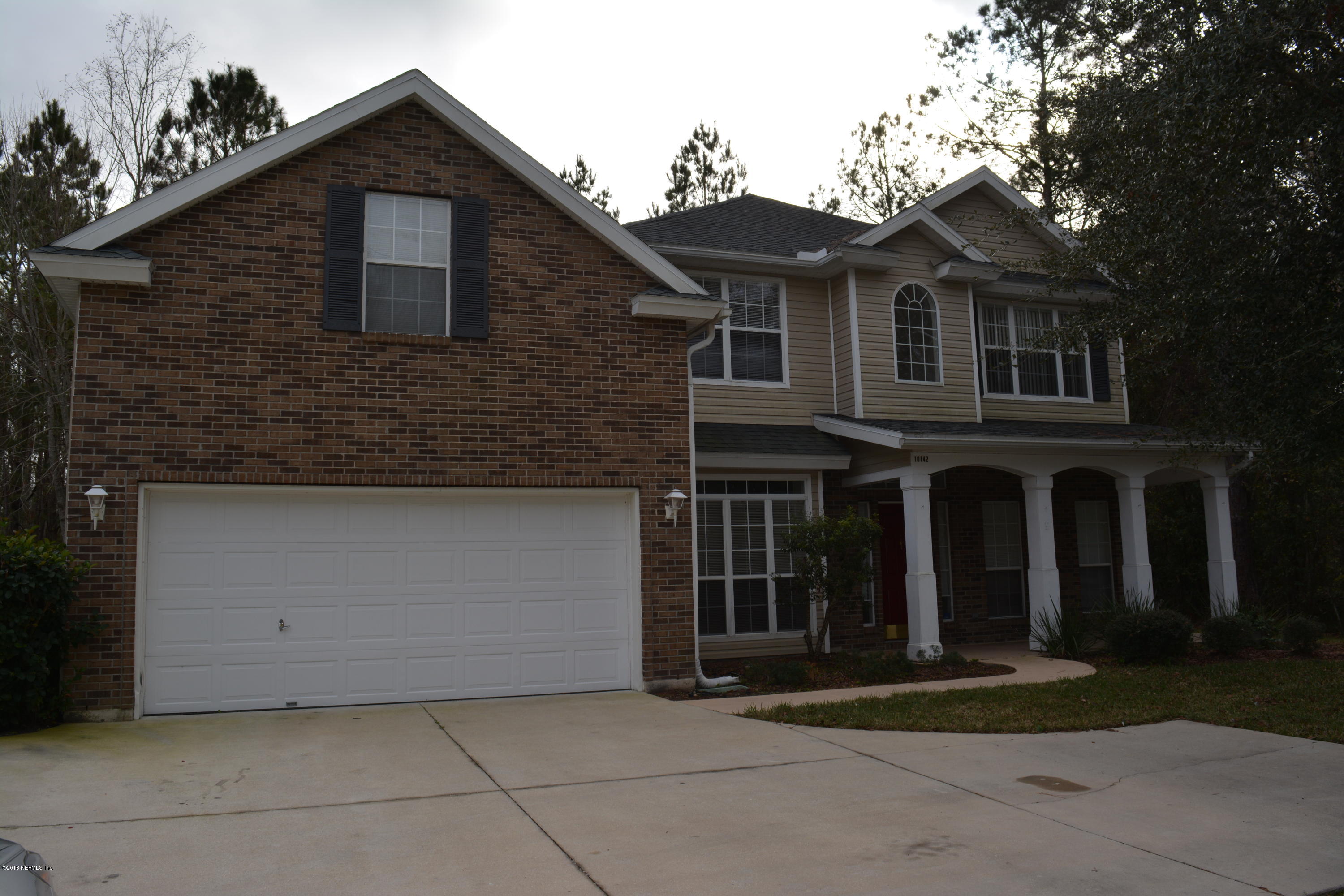 10142 Sandler Road Jacksonville, FL 32222 - Photo 33 of 33 a front view of a house with a yard