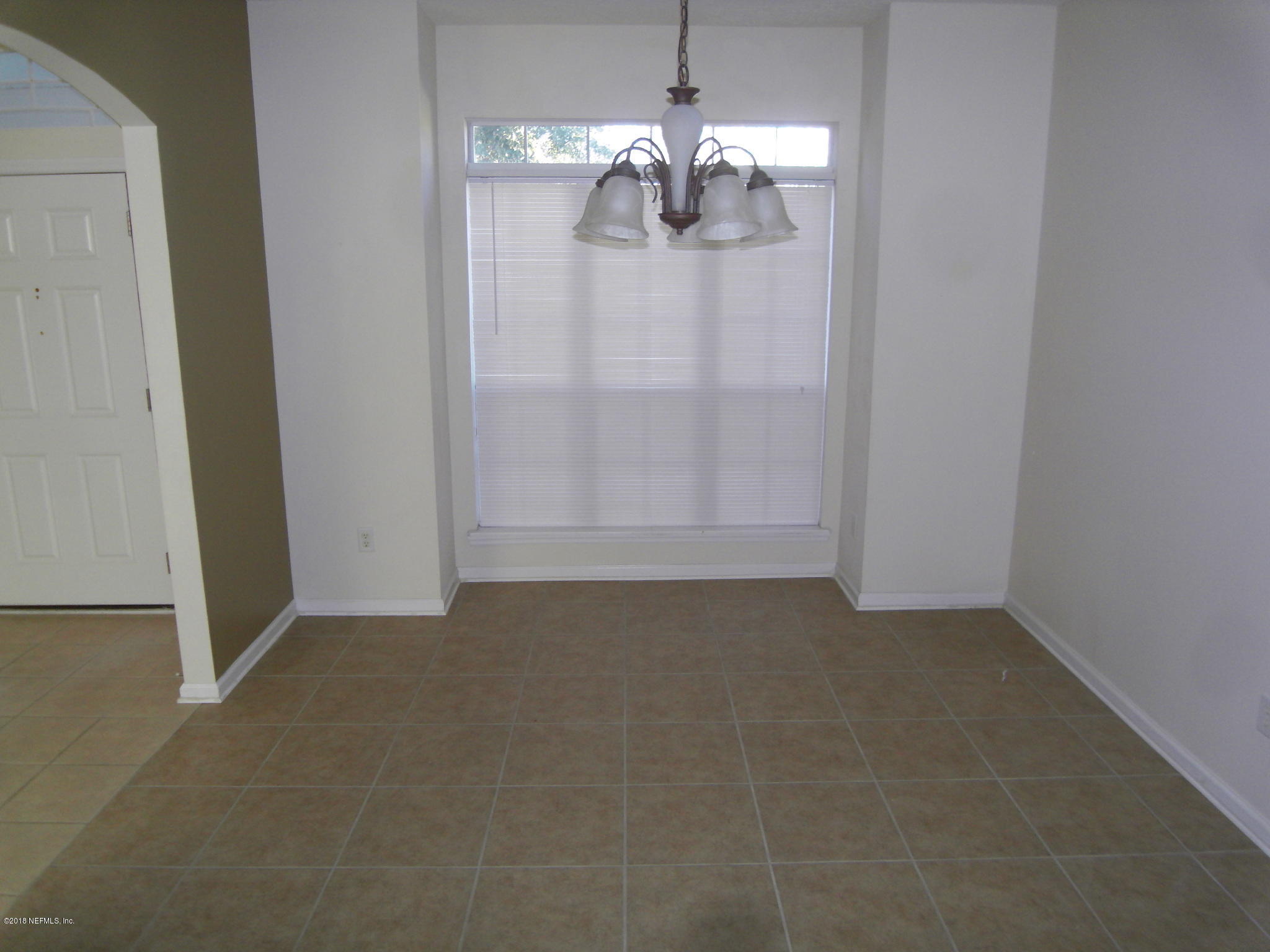 10142 Sandler Road Jacksonville, FL 32222 - Photo 4 of 33 a view of a chandelier in big room and chandelier fan