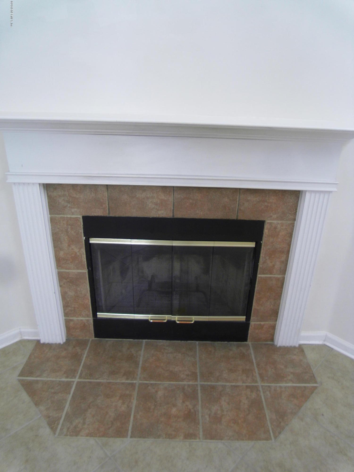 10142 Sandler Road Jacksonville, FL 32222 - Photo 7 of 33 a fireplace