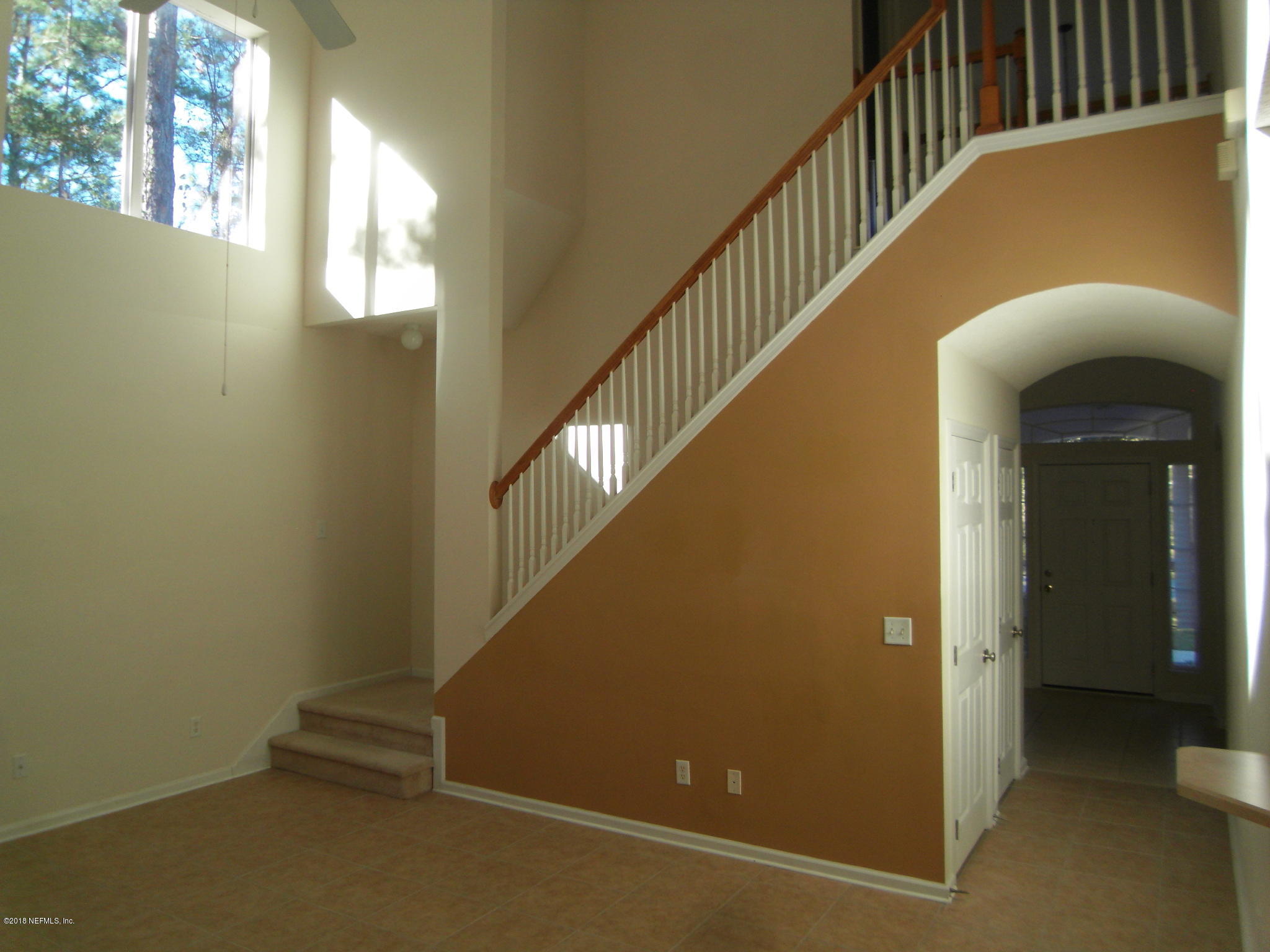 10142 Sandler Road Jacksonville, FL 32222 - Photo 8 of 33 a view of entryway with stairs and a window