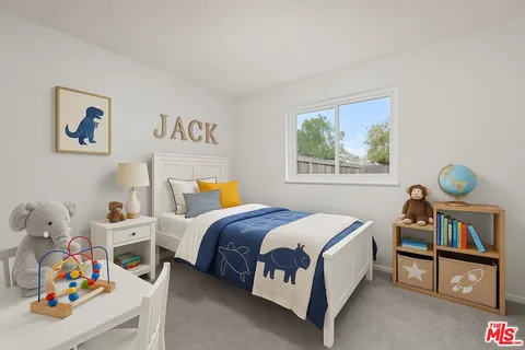 a bedroom with a bed a dresser and book shelf