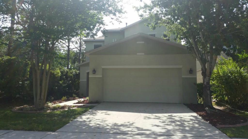 2349 Spring Hollow Loop Wesley Chapel, FL 33544 - Photo 1 of 1 a view of a house with a yard