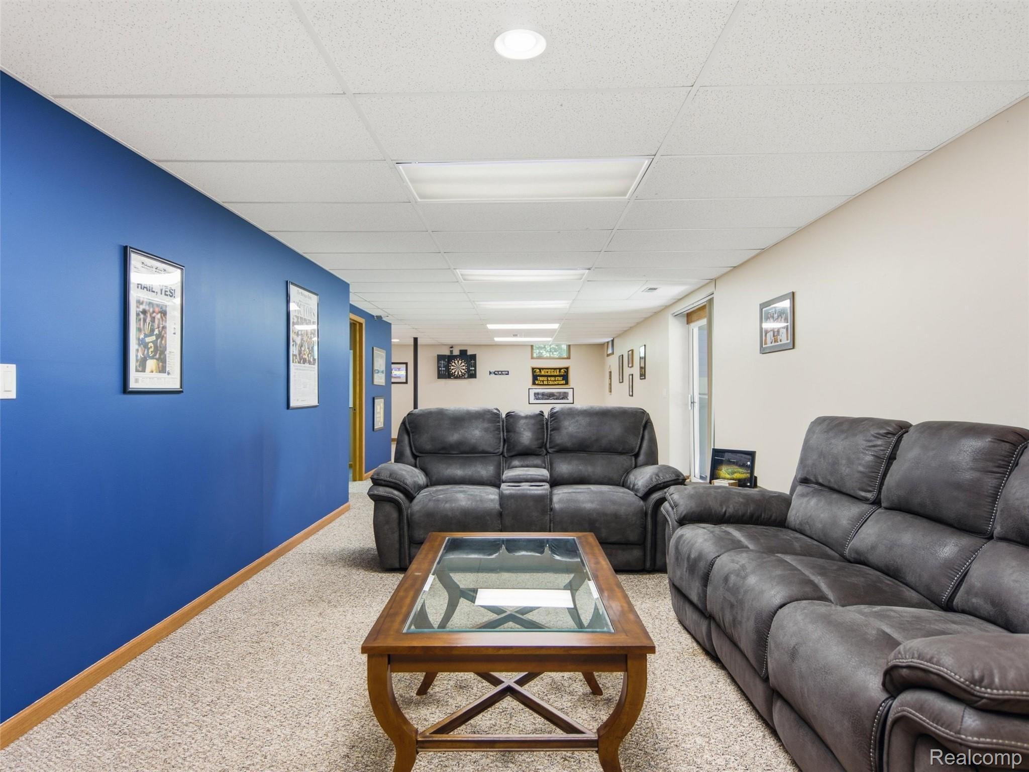 5003 Mason Road Howell, MI 48843 - Photo 26 of 59 Spacious room featuring neutral carpet flooring and a suspended ceiling with recessed lighting