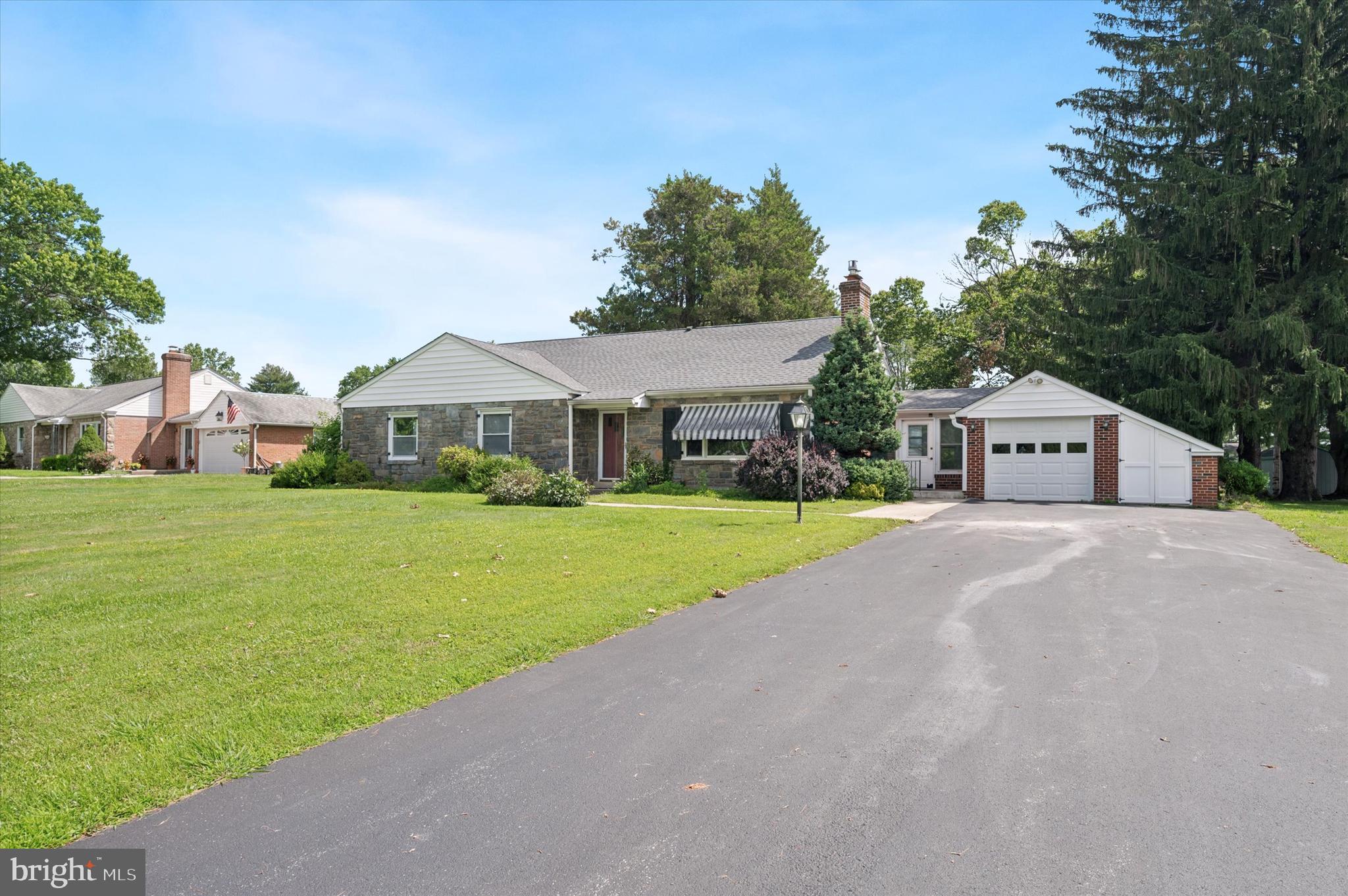 1007 Jamestown Road Broomall, PA 19008 - Photo 2 of 24 a house with garden in front of it