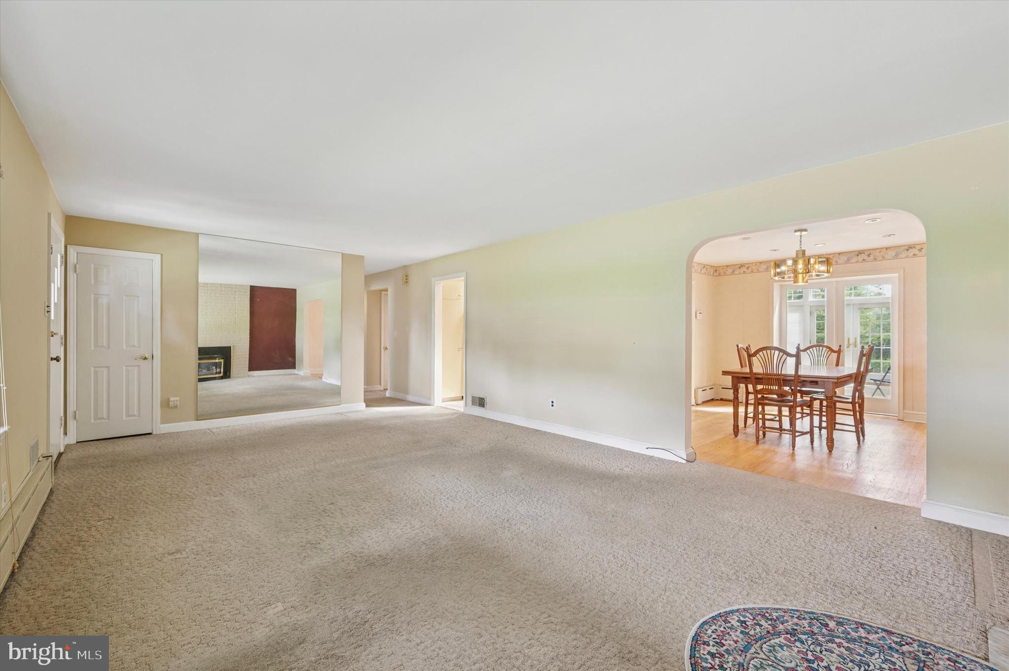 1007 Jamestown Road Broomall, PA 19008 - Photo 3 of 24 an empty room with furniture and a window