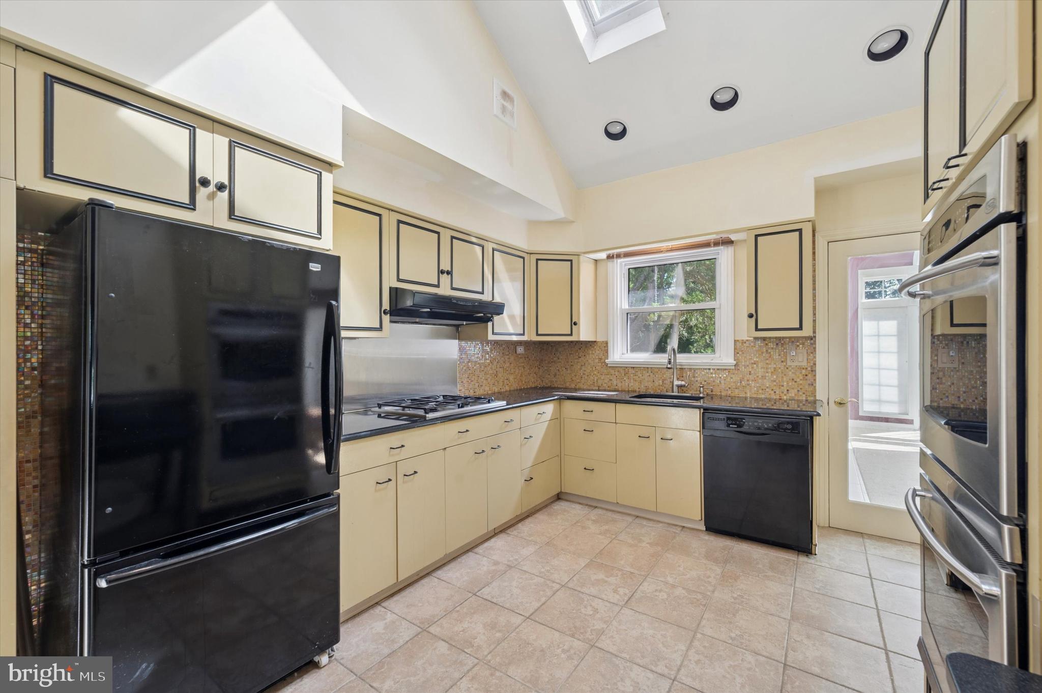 1007 Jamestown Road Broomall, PA 19008 - Photo 8 of 24 a kitchen with granite countertop stainless steel appliances a stove a sink and a refrigerator