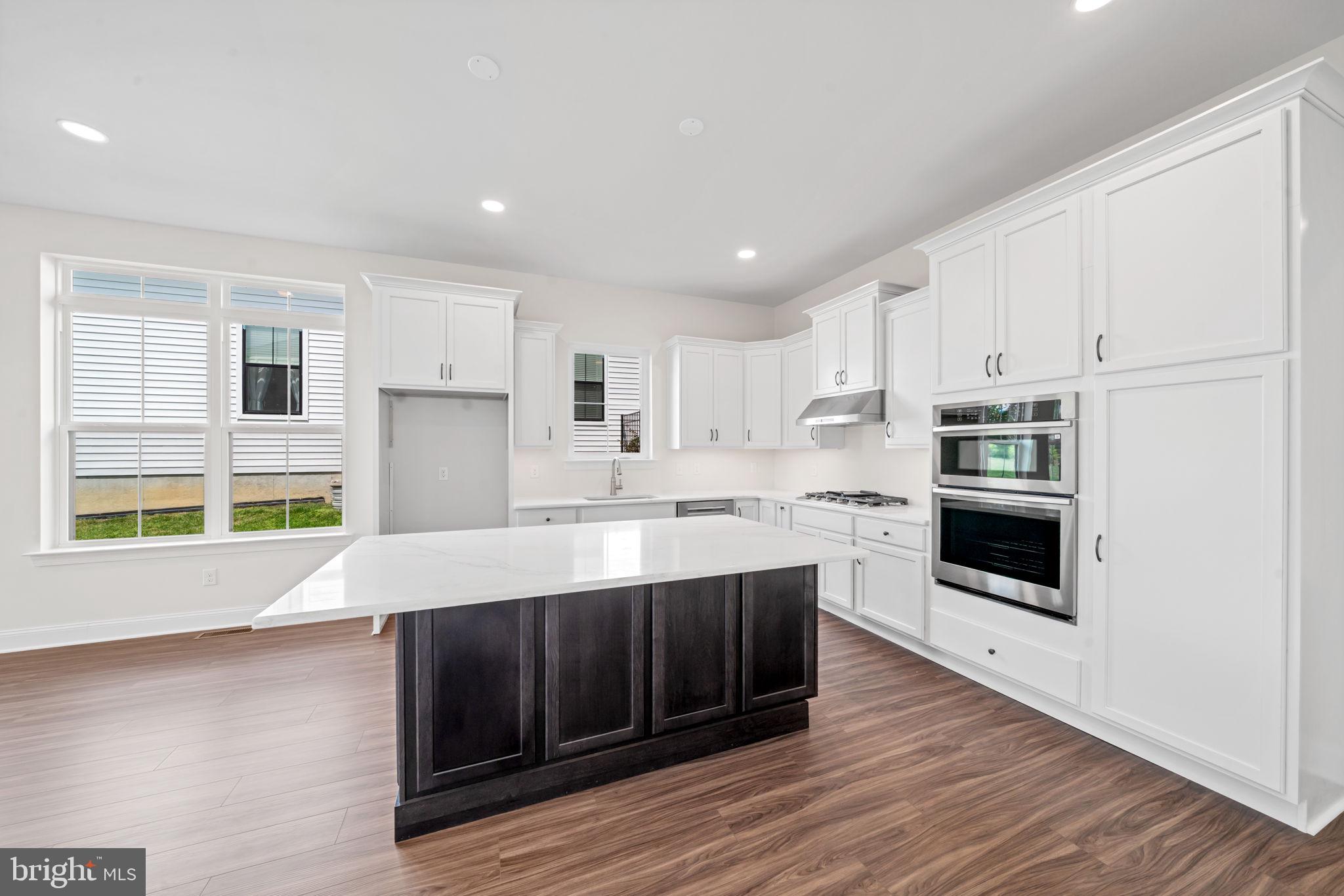 627 Appaloosa Road, Unit 251 Downingtown, PA 19335 - Photo 12 of 34 a kitchen with stainless steel appliances a stove a sink and a refrigerator