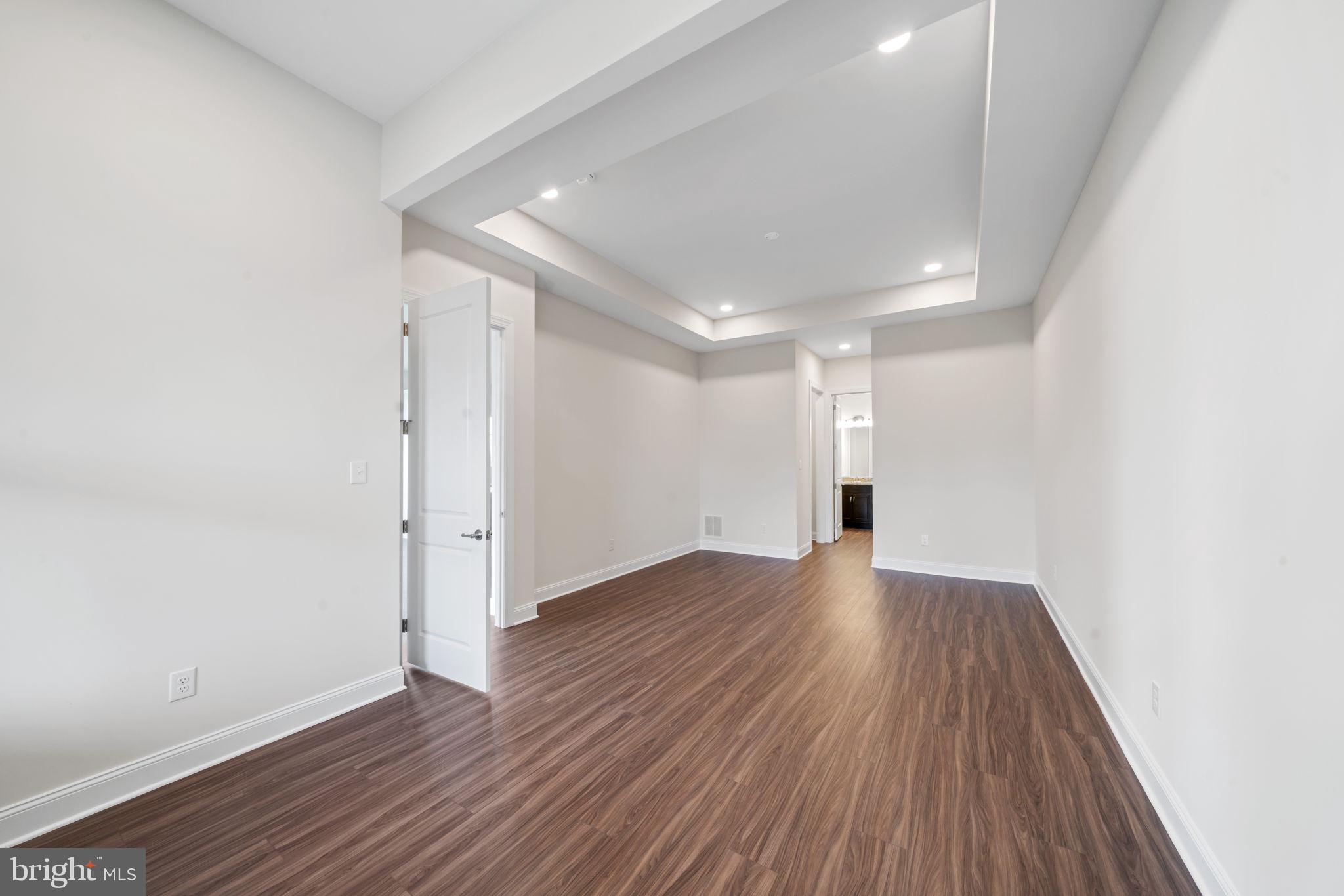 627 Appaloosa Road, Unit 251 Downingtown, PA 19335 - Photo 17 of 34 a view of an empty room with wooden floor