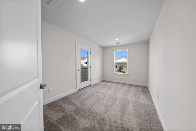 a bathroom with a sink a toilet a mirror and shower