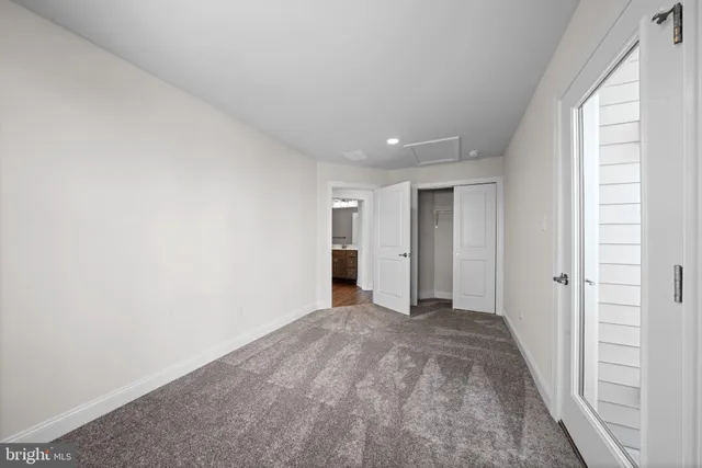 a view of an empty room and window