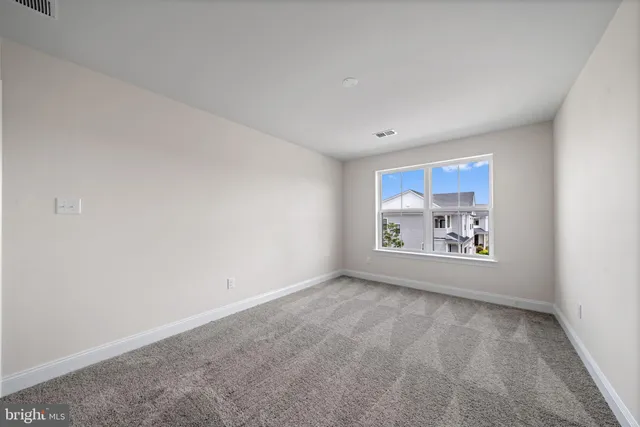 wooden floor and window in an empty room