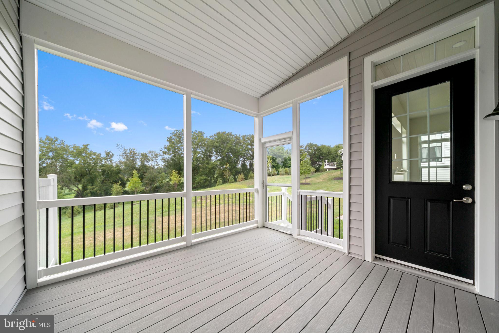 627 Appaloosa Road, Unit 251 Downingtown, PA 19335 - Photo 32 of 34 a view of a balcony with wooden floor