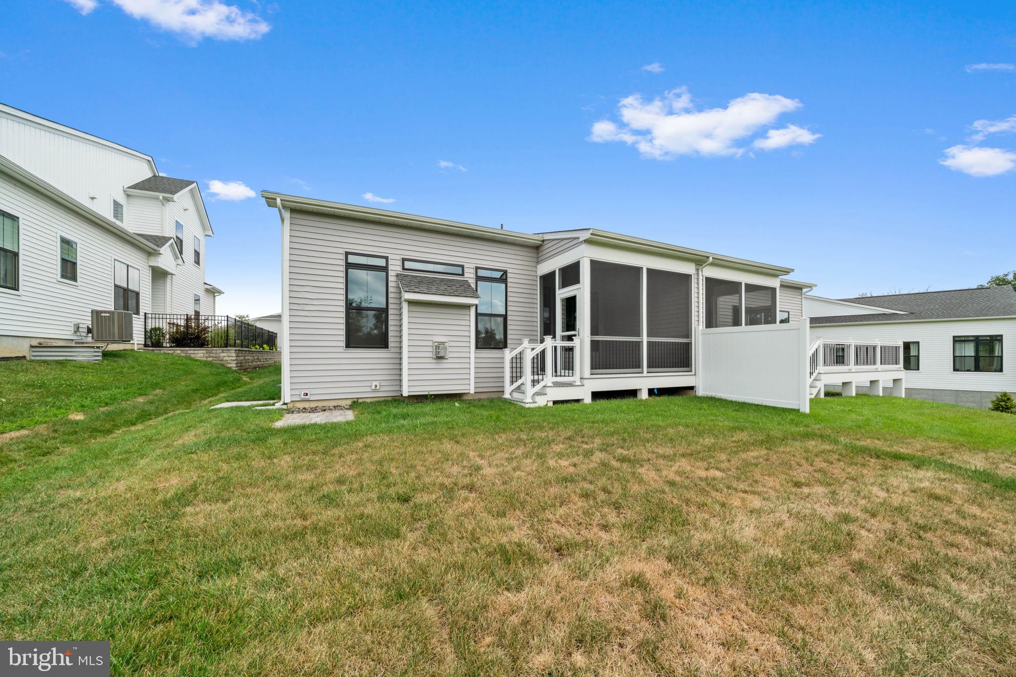 627 Appaloosa Road, Unit 251 Downingtown, PA 19335 - Photo 34 of 34 a view of a house with a backyard