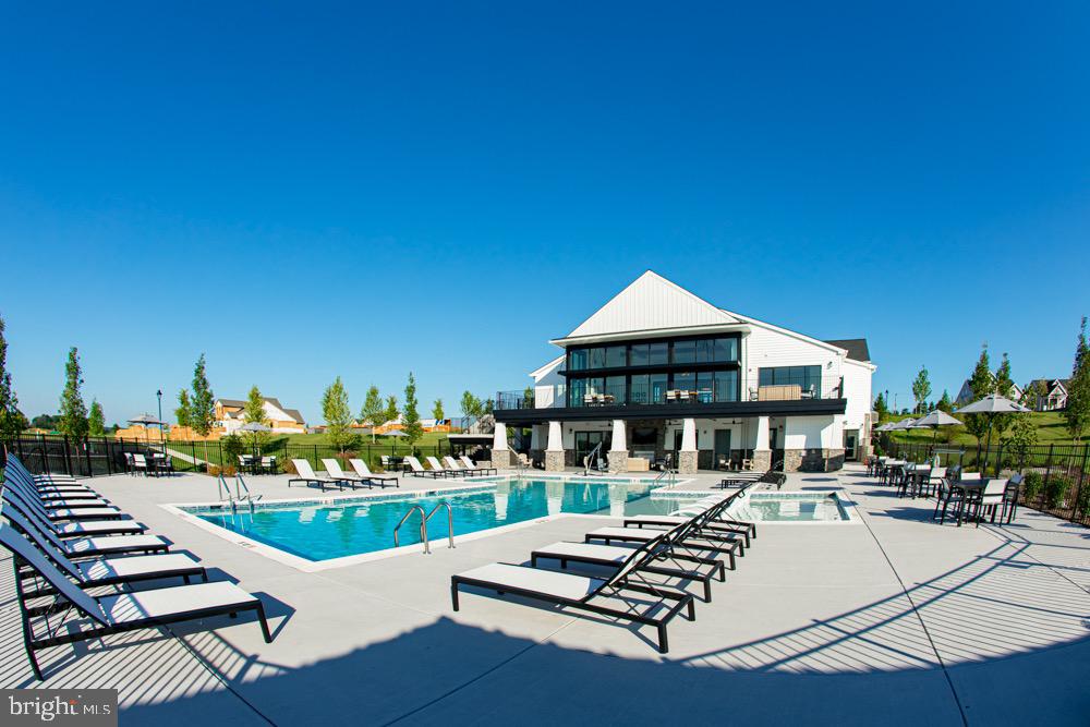 627 Appaloosa Road, Unit 251 Downingtown, PA 19335 - Photo 8 of 34 a view of a house with pool and chairs