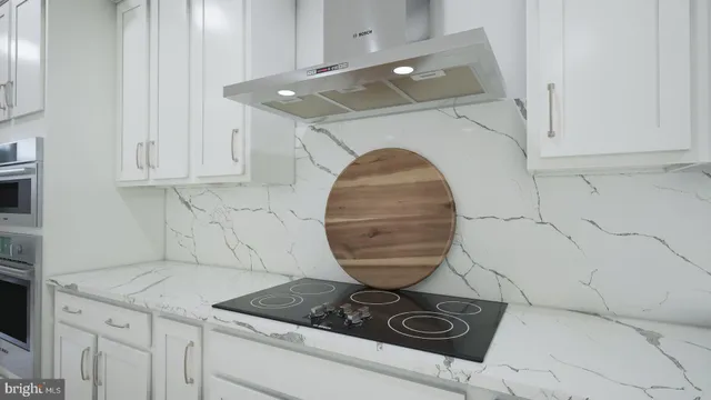 a kitchen with a stove and a sink