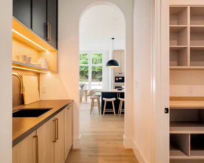 a view of a hallway with furniture and front door
