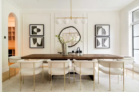 a living room with a granite countertop chairs and couches