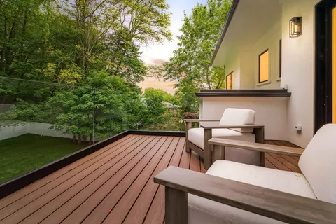 a view of roof deck with patio