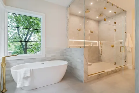 a bathroom with a bathtub and shower