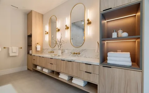 a bathroom with a double vanity sink and a mirror