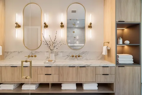 a bathroom with a double vanity sink and a mirror
