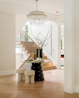a view of entryway and hall with wooden floor