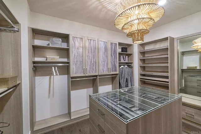 a kitchen with a stove and a chandelier