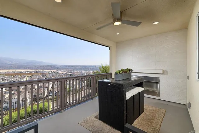 a view of a balcony with furniture