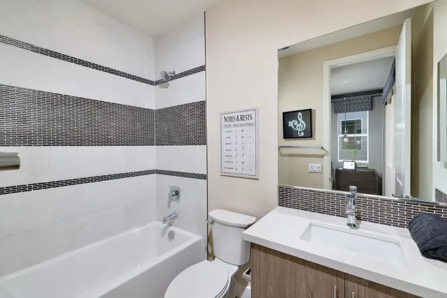 a bathroom with a sink a toilet and a bathtub