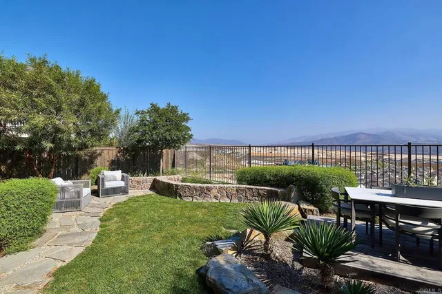 a view of a chairs and table in the garden