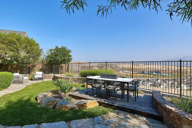 a balcony with furniture and garden