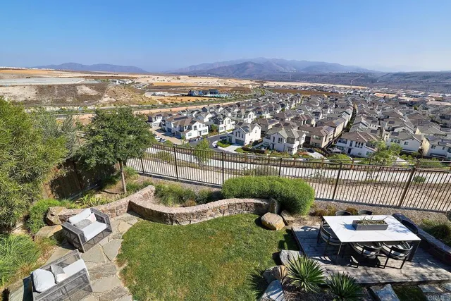 an aerial view of a house with a ocean view