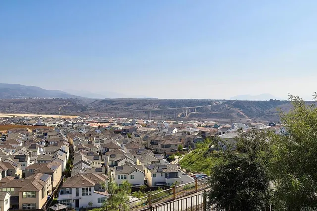 an aerial view of residential houses and city view