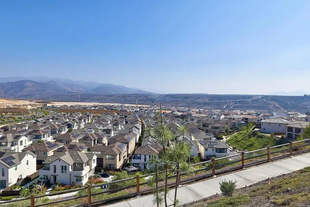 an aerial view of residential house and car parked